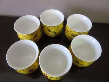 A gorgeous vintage bright yellow oriental dragon themed Chinese tea set .