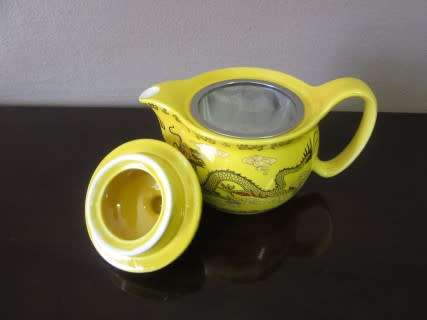 A gorgeous vintage bright yellow oriental dragon themed Chinese tea set .