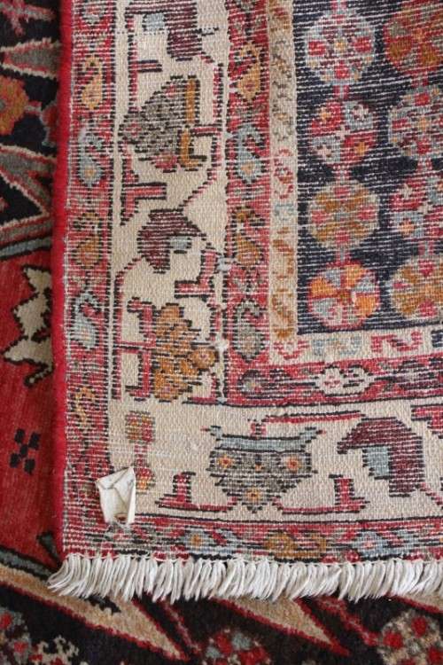 A stunning 125cm x 210cm hand knotted Persian carpet in bright reds. Gorgeous in all rooms!