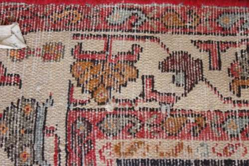A stunning 125cm x 210cm hand knotted Persian carpet in bright reds. Gorgeous in all rooms!