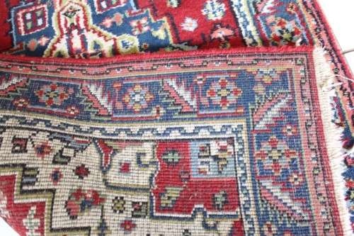 A stunning 95cm x 153cm hand knotted thick pile Persian carpet in dark reds. Gorgeous in all rooms!