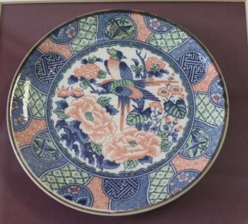 A gorgeous hand painted oriental "Imari" decorative porcelain plate in a box frame behind glass.