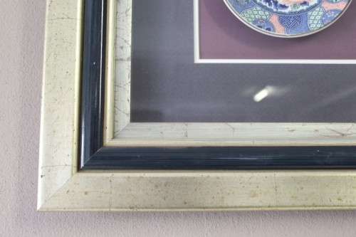A gorgeous hand painted oriental "Imari" decorative porcelain plate in a box frame behind glass.