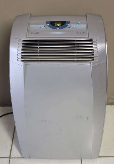 A fantastic De Longhi Pinguino PAC C110 portable air conditioner in full working order.