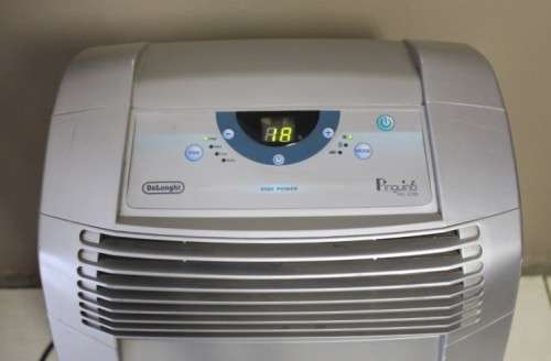 A fantastic De Longhi Pinguino PAC C110 portable air conditioner in full working order.