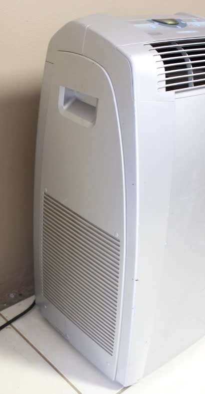A fantastic De Longhi Pinguino PAC C110 portable air conditioner in full working order.