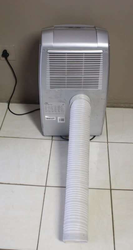 A fantastic De Longhi Pinguino PAC C110 portable air conditioner in full working order.