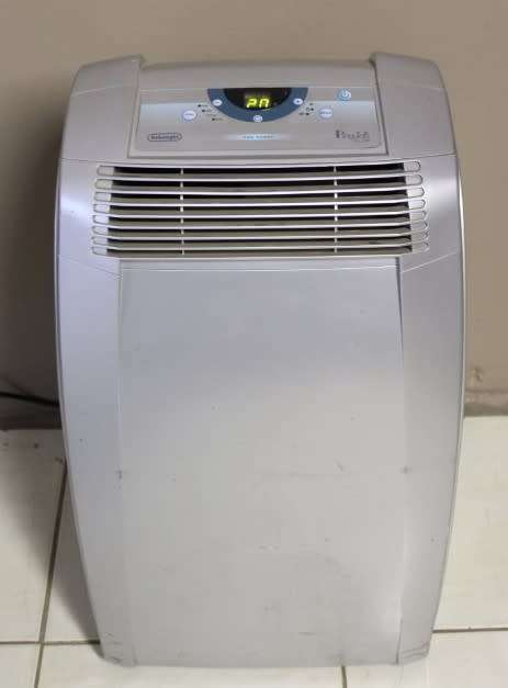 A stylish De Longhi Pinguino PAC C110 portable air conditioner in full working order.