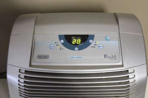 A stylish De Longhi Pinguino PAC C110 portable air conditioner in full working order.