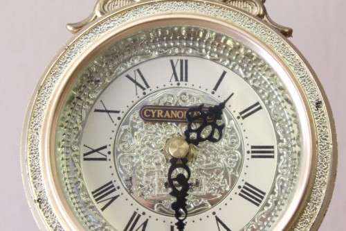 A beautiful vintage Cyranomatic battery operated swing pendulum clock w Quartz movement, working.