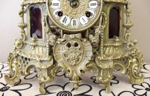 A remarkable vintage French solid brass Horseman mantle clock with Roman numerals