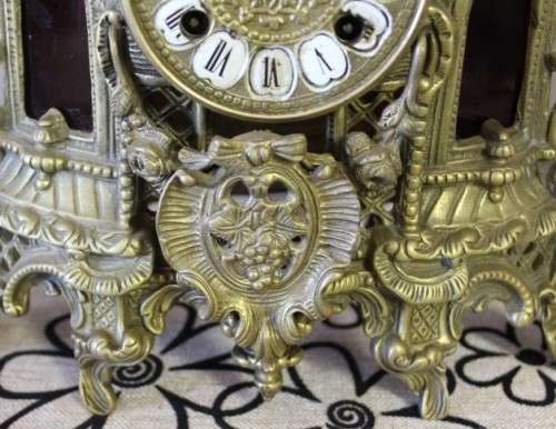 A remarkable vintage French solid brass Horseman mantle clock with Roman numerals