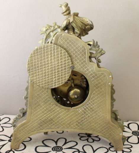 A remarkable vintage French solid brass Horseman mantle clock with Roman numerals