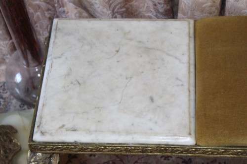 A lovely vintage marble and brass telephone table w/ a cushion, great in informal rooms!
