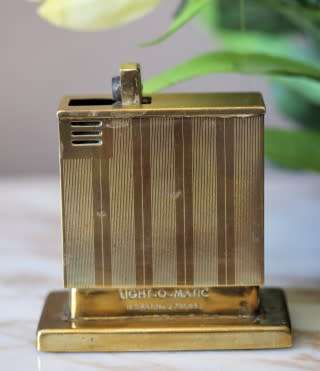 A beautiful, vintage (1950) gold plated, West German, Augusta Patent 'light-o-matic' table lighter.