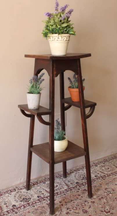 A gorgeous vintage dark Oak four tier planter/ display stand! Stunning indoors or on the patio!!