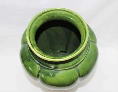 A fabulous large, green ceramic vase with a vase stand, fabulous on display.