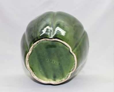 A fabulous large, green ceramic vase with a vase stand, fabulous on display.