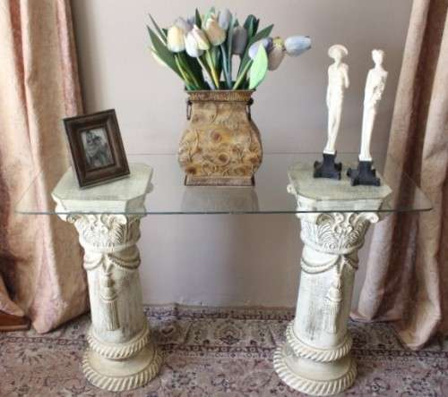 A stylish glass top hall table with two roped pillars. Stunning in all living areas!!!.