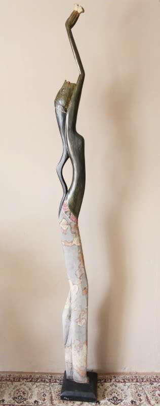 A stunning tall (198cm) floor standing traditional hand carved African lady. Lifespace Sale