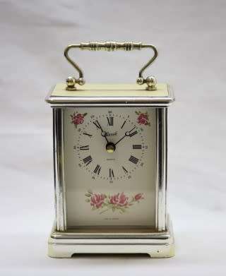 A gorgeous Hermle quartz table clock with a floral design, made in Germany.