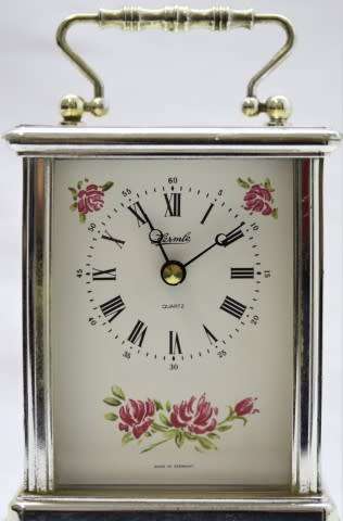 A gorgeous Hermle quartz table clock with a floral design, made in Germany.