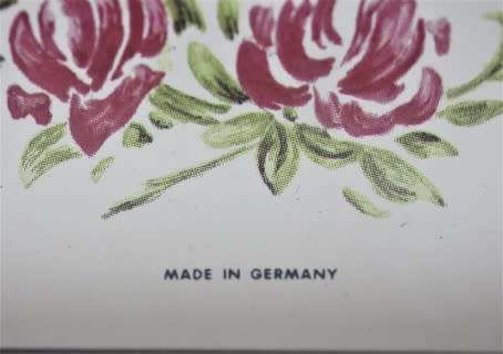 A gorgeous Hermle quartz table clock with a floral design, made in Germany.
