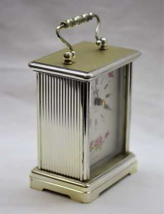A gorgeous Hermle quartz table clock with a floral design, made in Germany.