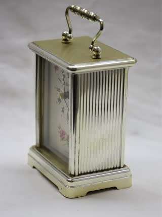 A gorgeous Hermle quartz table clock with a floral design, made in Germany.