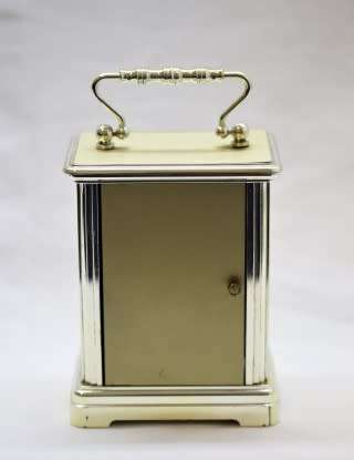 A gorgeous Hermle quartz table clock with a floral design, made in Germany.