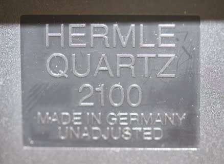 A gorgeous Hermle quartz table clock with a floral design, made in Germany.