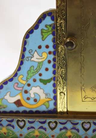 A stunning Junghans quartz table clock made of brass and blue enamel, styled with a gorgeous pattern