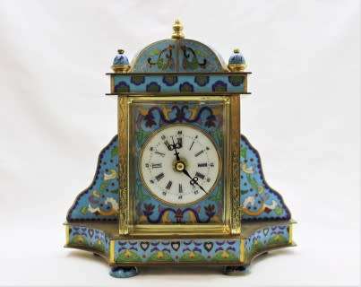 A stunning Junghans quartz table clock made of brass and blue enamel, styled with a gorgeous pattern