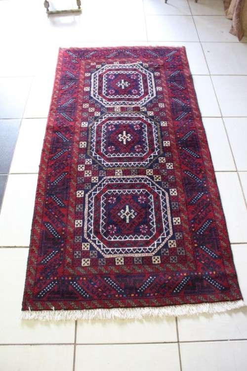 A fabulous vintage hand knotted thick pile Persian carpet (183cm x 91cm ) in good condition