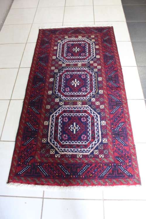 A fabulous vintage hand knotted thick pile Persian carpet (183cm x 91cm ) in good condition
