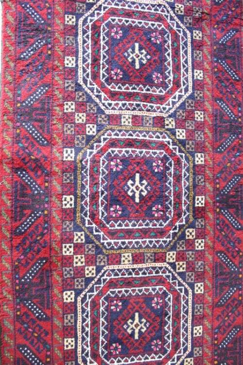 A fabulous vintage hand knotted thick pile Persian carpet (183cm x 91cm ) in good condition