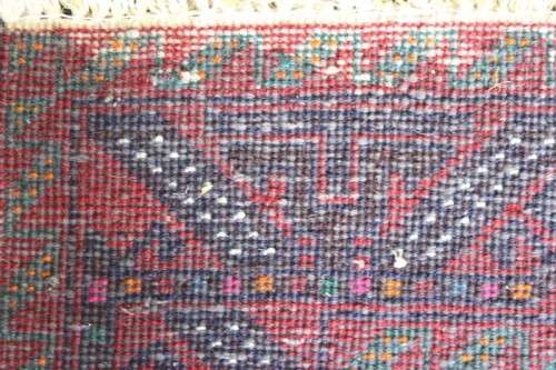 A fabulous vintage hand knotted thick pile Persian carpet (183cm x 91cm ) in good condition