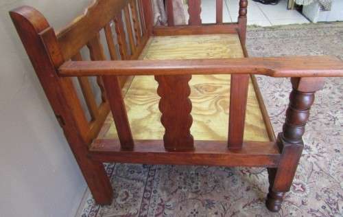 A wonderful well-made, sturdy vintage 2 seater Teak wood bench on castors, perfect  in a lapa/ patio