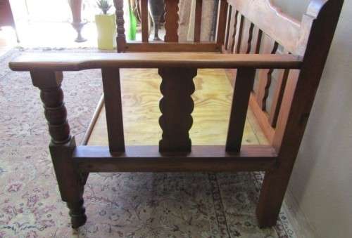A wonderful well-made, sturdy vintage 2 seater Teak wood bench on castors, perfect  in a lapa/ patio