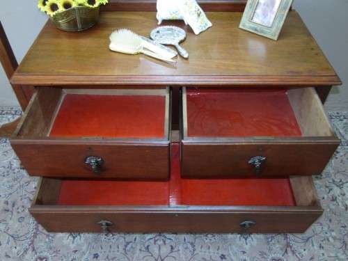 An amazing vintage Oak dressing table with a tilting bevelled centre mirror and three drawers.