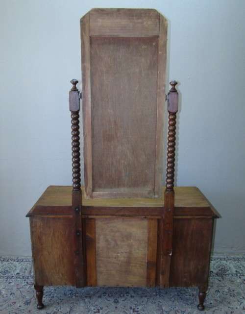 An amazing vintage Oak dressing table with a tilting bevelled centre mirror and three drawers.