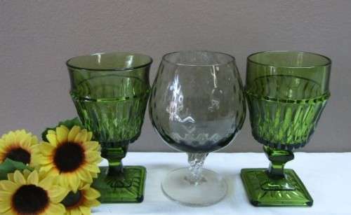 A fabulous set of 3 coloured glasses in different shapes and sizes!! Lovely on a summer table.