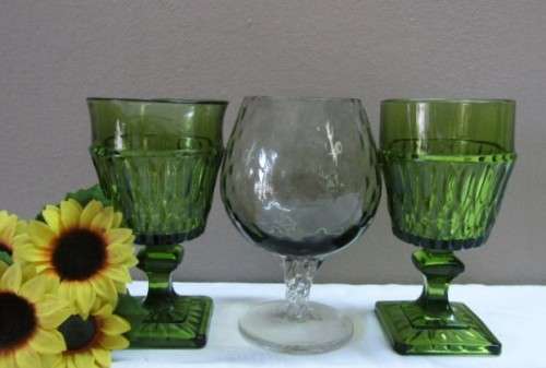 A fabulous set of 3 coloured glasses in different shapes and sizes!! Lovely on a summer table.