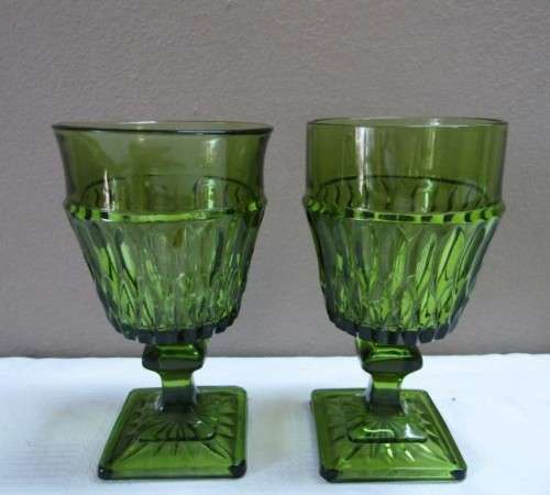A fabulous set of 3 coloured glasses in different shapes and sizes!! Lovely on a summer table.