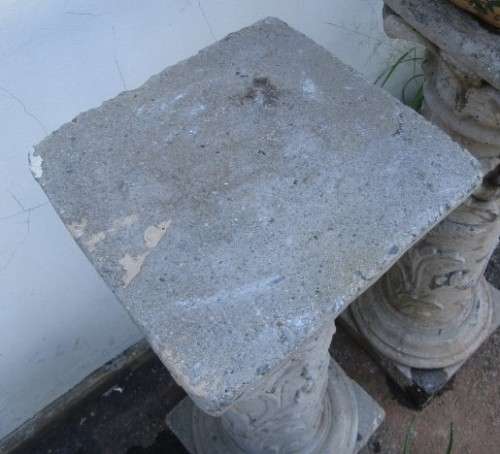 Two lovely concrete pillars. Perfect in a garden or drive way with a statue or plant!!