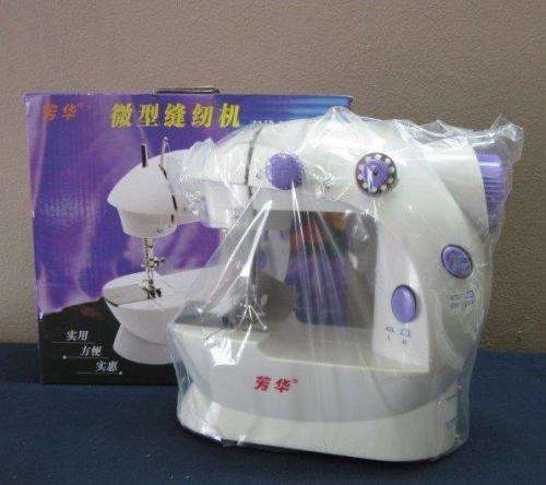 A lovely little mini travelling sewing machine in its original box. Brand new!!!