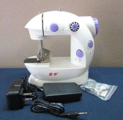 A lovely little mini travelling sewing machine in its original box. Brand new!!!