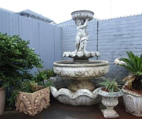 A fabulous, large three tier cherub water fountain. Stunning as a feature piece in a garden!!!