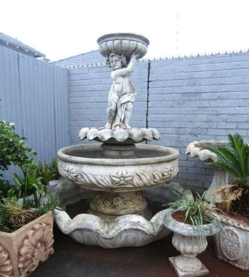 A fabulous, large three tier cherub water fountain. Stunning as a feature piece in a garden!!!