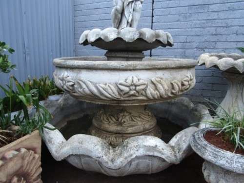 A fabulous, large three tier cherub water fountain. Stunning as a feature piece in a garden!!!